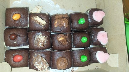 Brownie cake with various toppings