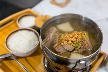 Beef brisket soup with rice in restaurant