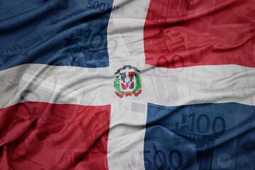 waving colorful national flag of dominican republic on a euro money banknotes background. finance concept.