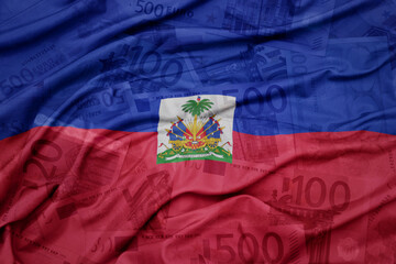 waving colorful national flag of haiti on a euro money banknotes background. finance concept.