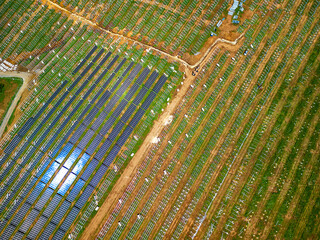 Solar farm construction site, large field for solar panels, aerial view