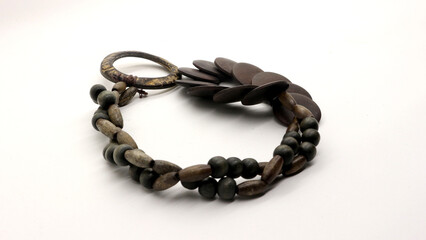 Close up of round wooden necklace isolated