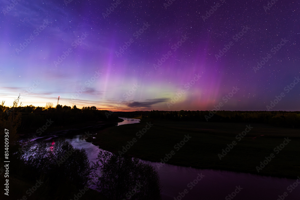 Wall mural aurora borealis, the northern lights at kuldiga, latvia.