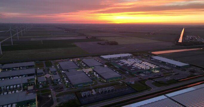 Data center at night in Hollandse Kroon, Middenmeer, The Netherlands at night. Cloud computing and internet infrastructure. Aerial drone view.