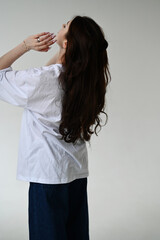 Fototapeta premium Teen age girl in blue jeans and white t-shirt