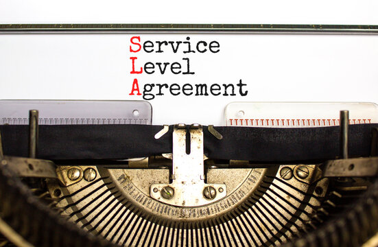 SLA service level agreement symbol. Concept words SLA service level agreement typed on beautiful retro typewriter. Beautiful white background. Business SLA service level agreement concept. Copy space.