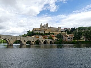 Béziers, May 2024: Visit the magnificent city of Béziers in Occitanie. Street photos - View of Saint-Nazaire and Saint-Celsus cathedrals 
With the Pont Vieux