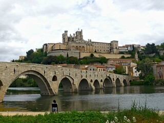 Béziers, May 2024: Visit the magnificent city of Béziers in Occitanie. Street photos - View of Saint-Nazaire and Saint-Celsus cathedrals 
With the Pont Vieux