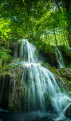 Beautiful spring waterfall Dokuzak in Strandzha Mountain, Bulgaria . Strandja mountain, waterfall in the forest. Magnificent landscape near Burgas
