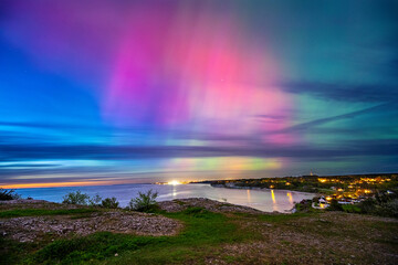 Northern light dancing over the Baltic sea at island of Gotland.