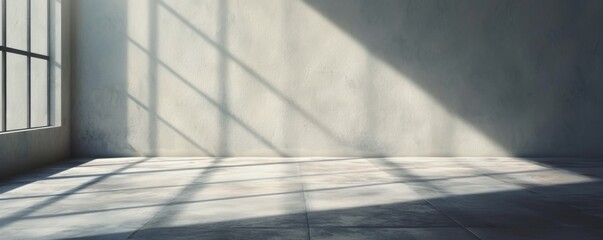 Sunlight casting shadows on a smooth concrete floor