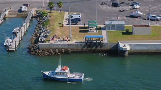 Cruise ship departs from Port Canaveral sailing past local boat marinas, island lifestyle