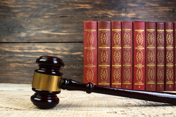 Law and Justice, Legality concept, Judge Gavel on a wooden background, Law library concept.
