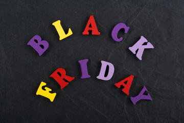 BLACK FRIDAY word on black board background composed from colorful abc alphabet block wooden...