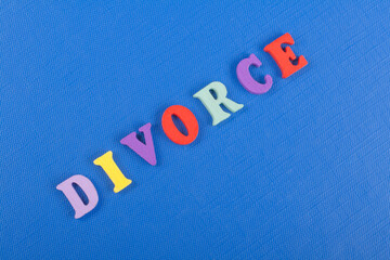 DIVORCE word on blue background composed from colorful abc alphabet block wooden letters, copy...