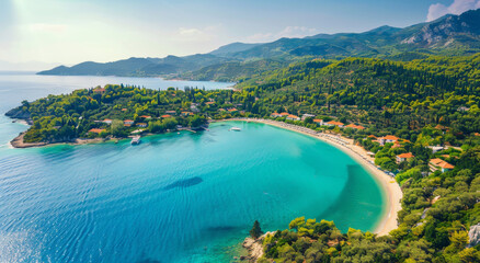 Aerial view of a beach in Greece, with turquoise water and lush greenery surrounding it, showcasing...