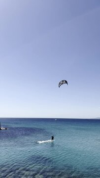 A group of kitesurfers surfing in the Gibraltar area