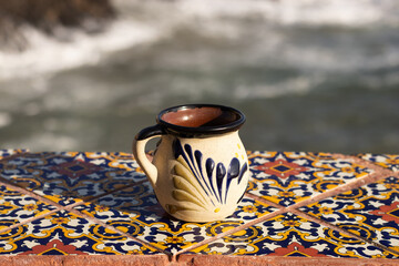 traditional mexican cup of coffee, facing the sea