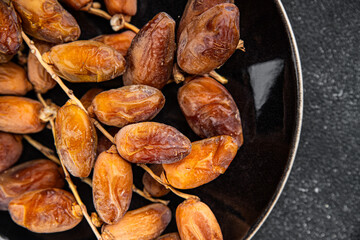 date branch dried fruit fresh appetizer food snack on the table copy space food background rustic...