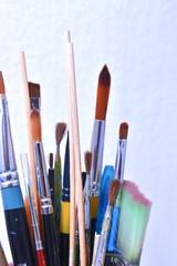 a set of dirty brushes and paintbrushes from having painted too much