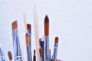 a set of dirty brushes and paintbrushes from having painted too much