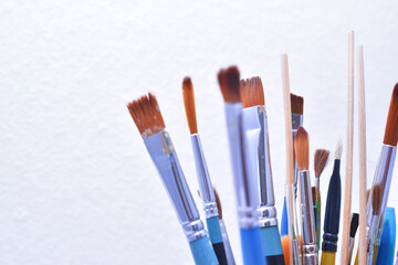 a set of dirty brushes and paintbrushes from having painted too much
