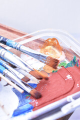 a set of dirty brushes and paintbrushes from having painted too much