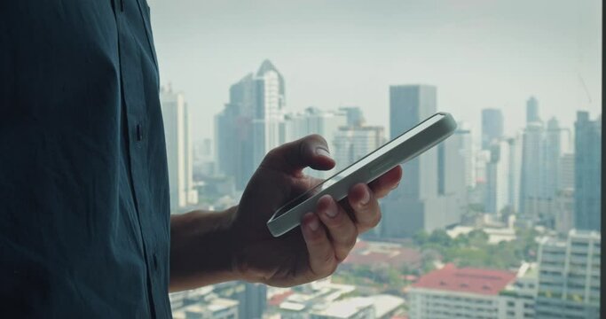 Person holding using mobile phone digital world backdrop towering skyscrapers. Urban landscape modern technology human life telephone pulse of city shaping experience of bustling metropolis.