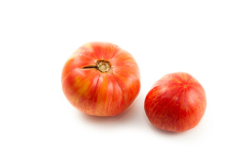 Two pink tomatoes isolated on white background with clipping path. .