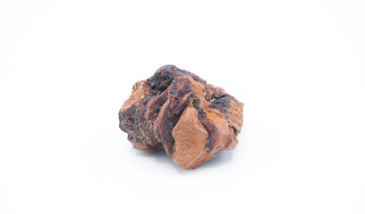 red and black porous volcanic rock called scoria, an igneous formation from volcanic gasses mixing with magma before spewing from a volcano. isolated on white background. used in grills and landscapes