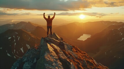 Free man at the top of the mountain at the sunset hands up