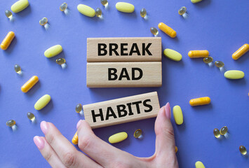 Break bad habits symbol. Concept words Break bad habits on wooden blocks. Beautiful purple...