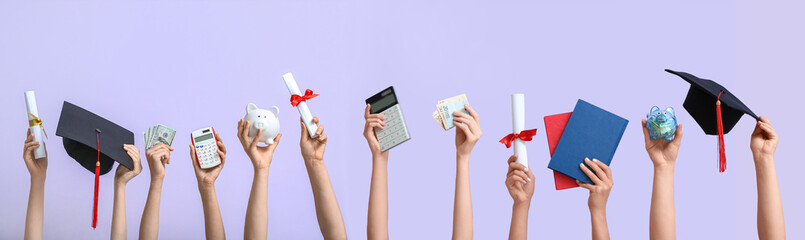 Female hands holding piggy bank, graduation cap, diplomas and money on lilac background. Student loan concept