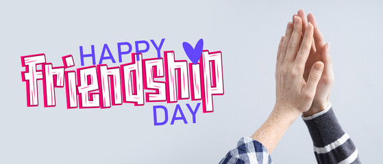 Women touching with palms on light background. Friendship concept