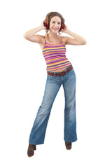 Joyful young woman who is listening to music through red headphones, dancing and looking at camera with her blue eyes while being isolated against a white background