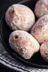 donut filled with powdered sugar
chocolate filling fresh appetizer meal food snack on the table copy space food background 