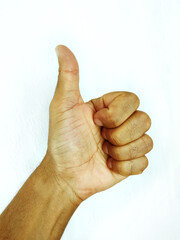 Closeup of black male hand showing thumbs up sign. ok sign.
