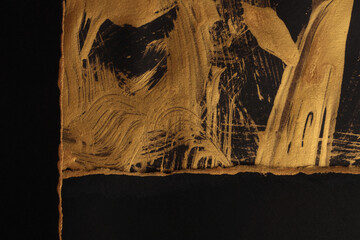Gold, bronze and black paper paper torn frame painting wall. Abstract glow texture copy space relief background.