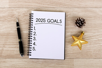 2025 goals text on notepad New Year concept