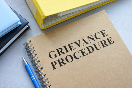 Grievance procedure and yellow folder.