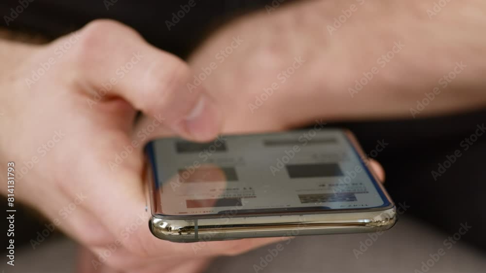 Aufkleber man browsing on cellphone, scrolling pictures on device screen, close up