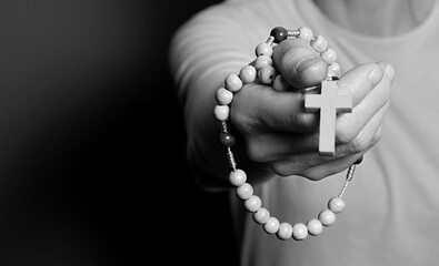 praying to god with cross and hands together with black background with people stock image stock...