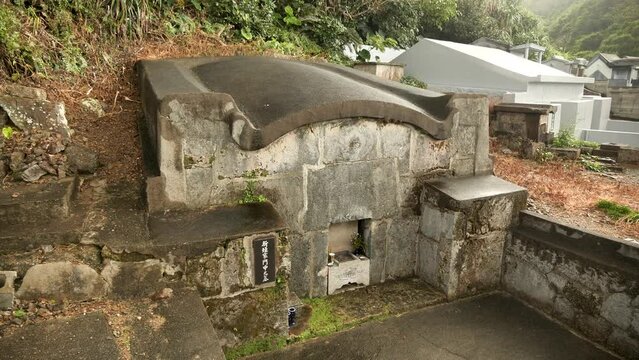 Typical Japanese Cemetery in Okinawa Islands, Japan. The peculiarly shaped Okinawan tombs known as kamekoubaka. The traditional Okinawan turtleback tomb. High quality 4k footage