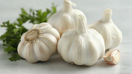   A bowl of garlic and parsley sits atop a white countertop