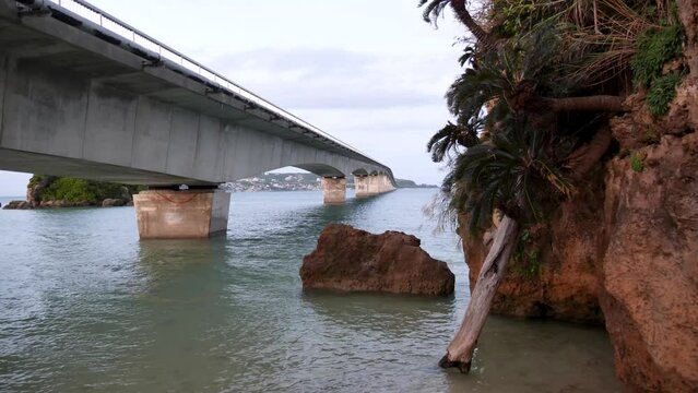 Kouri Big Bridge at sunset Okinawa Island, Japan. Dramatic weather. High quality 4k footage.