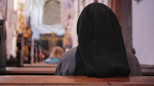 Catholic Nun Wearing Grey Religious Habit Tunic Saying Prayer During Holy Mass