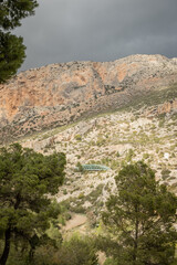 hiking trail caminito del rey, kings walkway, in Malaga Spain. narrow footpath leads through natural beauty mountain range cliff faces of gaitanes gorge. hisotric landmark popular tourist attraction
