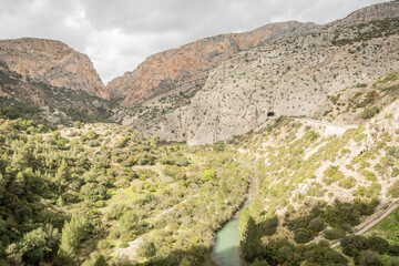 hiking trail caminito del rey, kings walkway, in Malaga Spain. narrow footpath leads through natural beauty mountain range cliff faces of gaitanes gorge. hisotric landmark popular tourist attraction