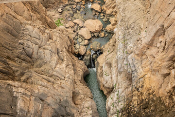 hiking trail caminito del rey, kings walkway, in Malaga Spain. narrow footpath leads through natural beauty mountain range cliff faces of gaitanes gorge. hisotric landmark popular tourist attraction