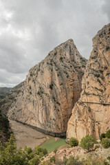 hiking trail caminito del rey, kings walkway, in Malaga Spain. narrow footpath leads through natural beauty mountain range cliff faces of gaitanes gorge. hisotric landmark popular tourist attraction